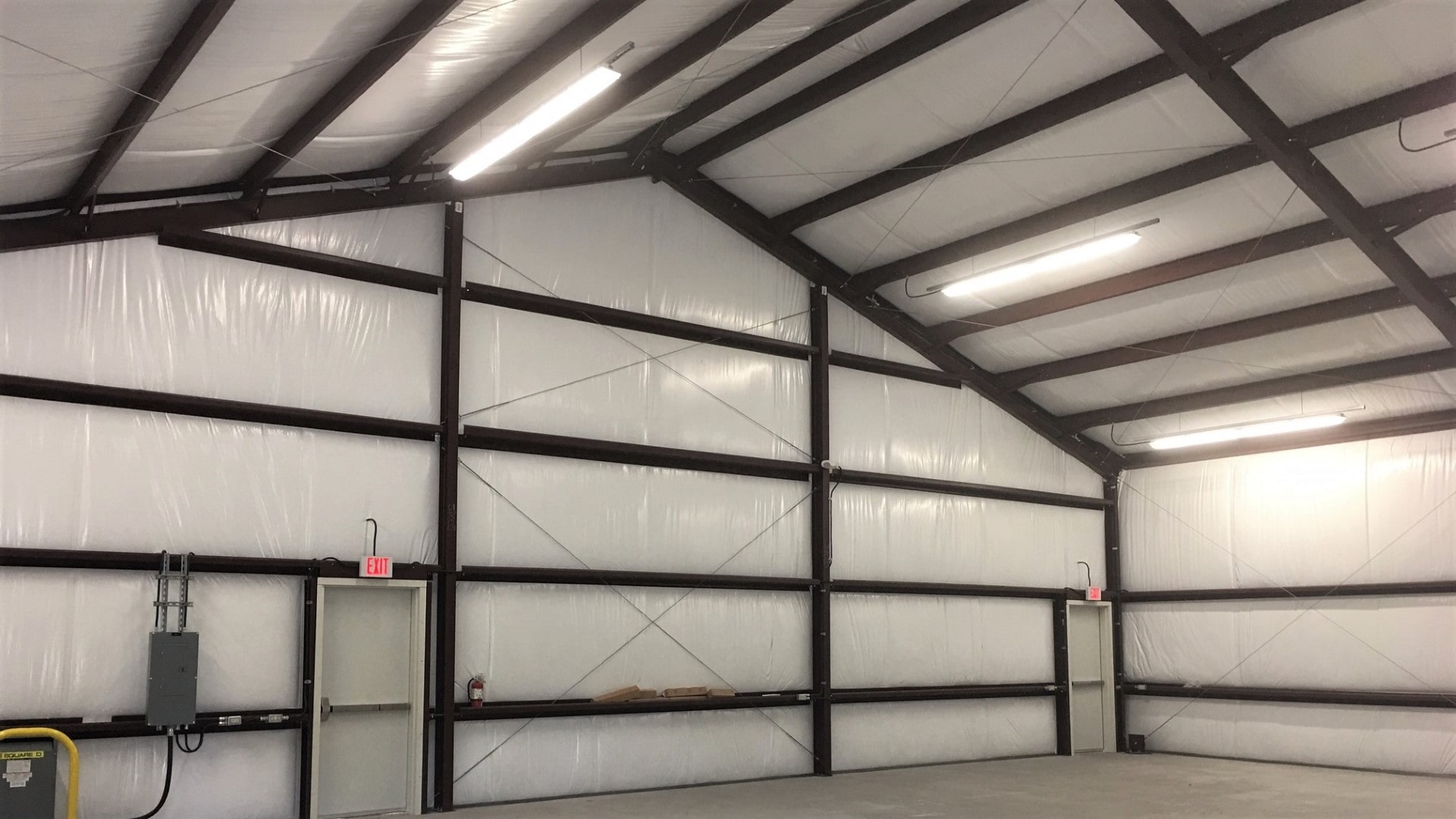 WMP-10 white-faced fiberglass insulation installed in a metal building