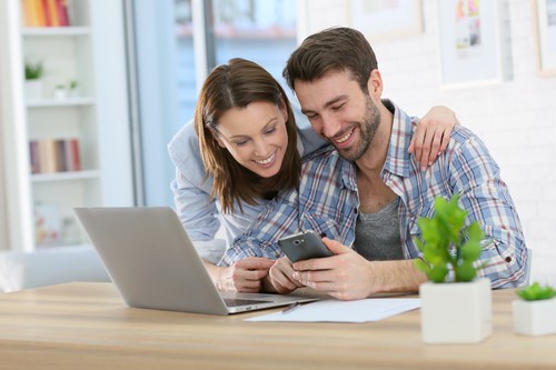 Couple reviewing their order and paying the service fee